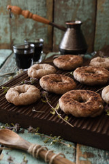 Coffee time. Homemade wholegrain cookies and coffee brewed in Turkish pot on oak board on shabby blue background