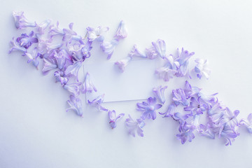 Mock-up white Business card on a white background in purple colours hyacinth