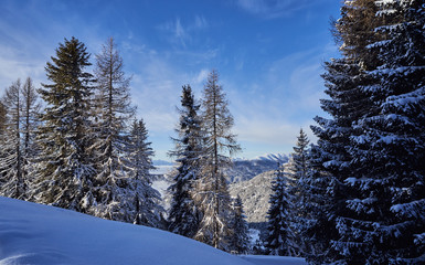 Brunnach Ski Ressort, St. Oswald, Carinthia, Austria - January 20, 2019: View over the slope to the Nockberge, Carinthia, Austria beyond.