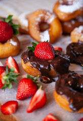 Homemade donuts with powdered sugar and strawberry 