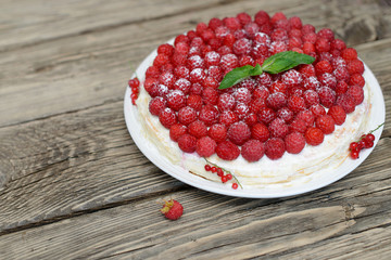 Raspberry cake on wooden table