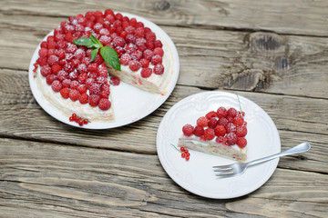 Raspberry cake on wooden table