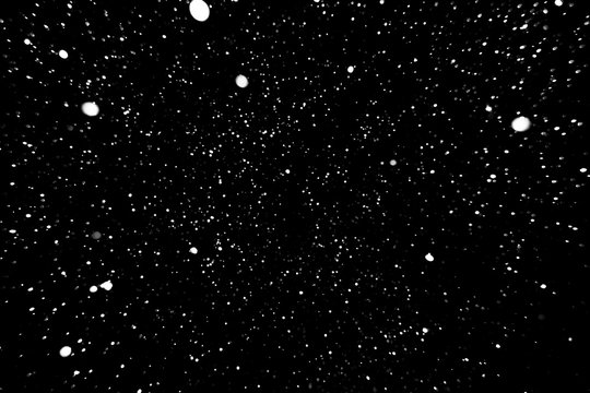 falling snow on a black background, snowfall at night, white spots on a black background