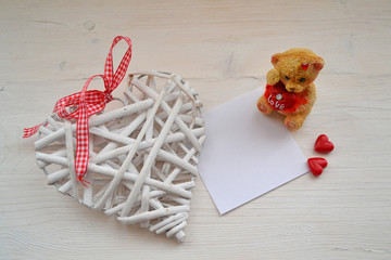 Love card for concept design in rustic style. Heart with teddy for copyspace. Festive greeting card. Holiday card.