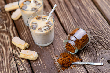 Iced iced coffee on a wooden table. Summer drinks.