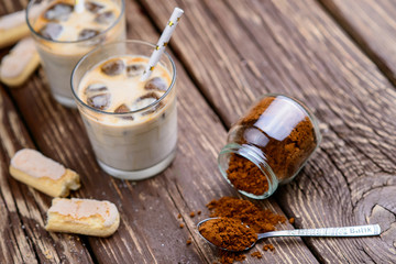 Iced iced coffee on a wooden table. Summer drinks.