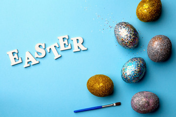 Lettering for Easter with eggs and brush
