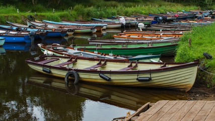Fototapeta na wymiar Rowboats Near Ross Castle