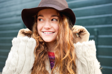 jacket teenage closeup fur standing hat smiling against