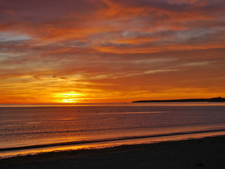 Fototapeta na wymiar Red sunrise on the Atlantic Ocean