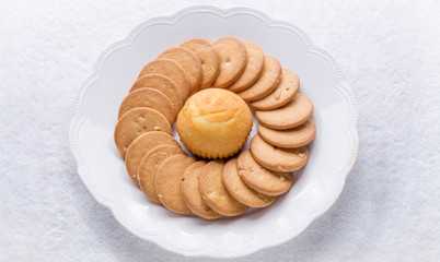 cookies with cupcake on white plate