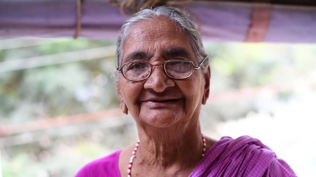 indian old women closeup portrait smile face with glasses
