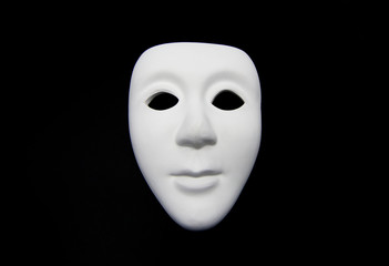 White mask on a black background 