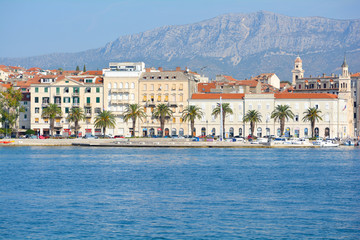 Morning view of city downtown centre from the tour boat. Old town with houses made of stones and orange sealing.