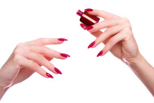 Bright festive red manicure on female hands. Nails design