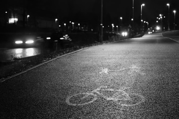 Asphalt way in Mostecka street in czech city of Chomutov  in rainy evening on 15th january 2019