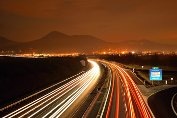 Highway D8 and Lovos hill on horizont in night on 16th january in czech republic