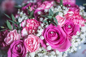 Brides bouquet with roses and pearl decoration 