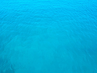Aerial top water surface view background. Bird eye sea surface photo. Blue transparent crystal sea from above. Minimal. Near island Solta south of Split, Dalmatian archipelago, Croatia.