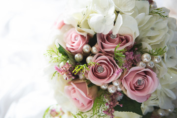 Bridal flowers bouquet with roses and ribbon