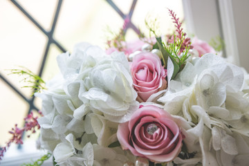Bridal flowers bouquet with roses and ribbon