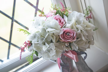 Bridal flowers bouquet with roses and ribbon