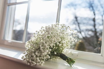 Brides bouquet displayed on window before a wedding