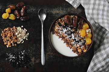 Bright healthy breakfast bowl with white yogurt, granola, seeds and dried fruit. Keto diet. Keto breakfast. The concept of proper nutrition.