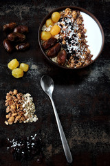 Bright healthy breakfast bowl with white yogurt, granola, seeds and dried fruit. Keto diet. Keto breakfast. The concept of proper nutrition.