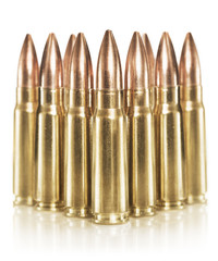 Golden rifle cartridges isolated on white background