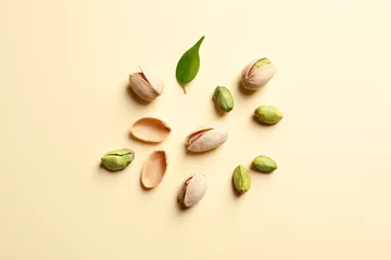 Foto op Plexiglas Composition with organic pistachio nuts on color background, flat lay © New Africa