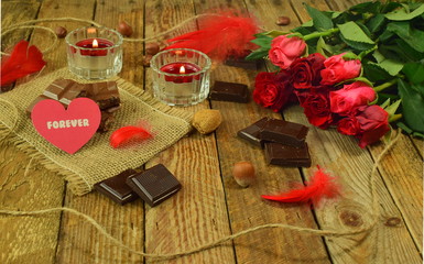 Forever Valentine's Day background with 7 roses, candles and chocolade