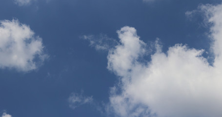 Naklejka na ściany i meble Clouds are rolling in the blue sky.
