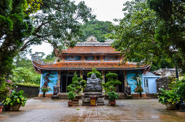 Temple in Vietnam between trees