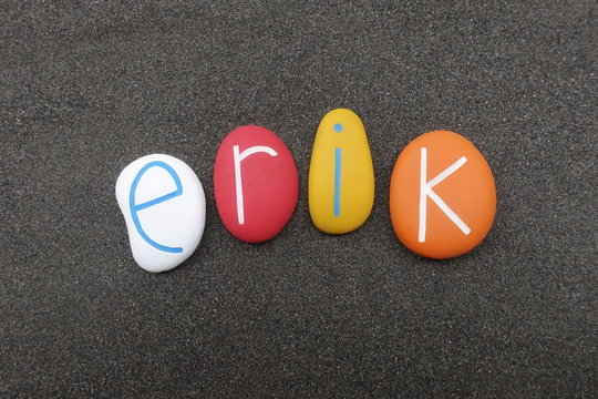 Erik, masculine given name composed with colored stones over black volcanic sand