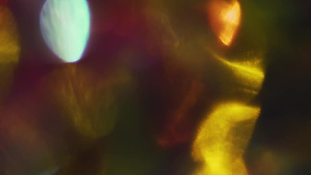Luxury gorgeous multicolored particles gently flickering in the dark.