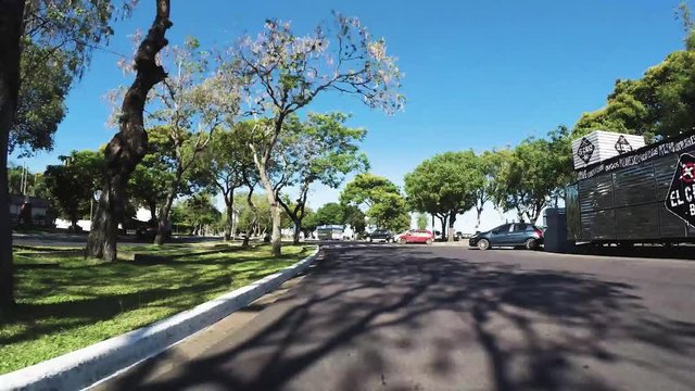 Timelapse driving POV through city in Argentina over General Belgrano Bridge crossing Paran&radic;&deg; River.