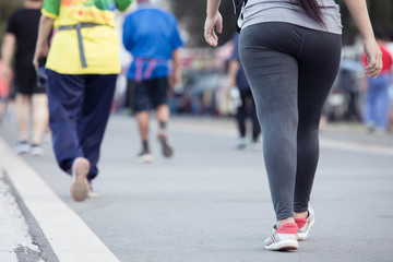 People jogging in the park,young woman jogging in city park