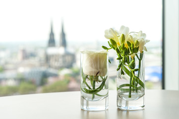Cologne dom blurry behind floral arrangement