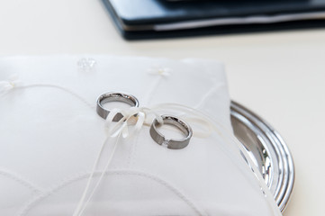 Wedding rings on small pillow
