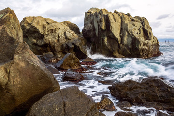 Fototapeta na wymiar The rocks in the sea