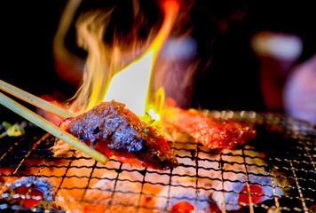 Japanese grilled meat over charcoal on stove