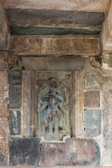 Belur, Karnataka, India - November 2, 2013: Chennakeshava Temple building. Stone statue of Lord Vishnu on wall of temple.