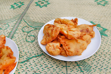 Pisang goreng (fried banana) in a plate on the straw mat at Yogyakarta, Indonesia