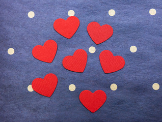 Obraz premium several red hearts on a blue background. celebration. Valentine's Day