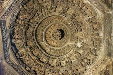 Belur, Karnataka, India - November 2, 2013: Chennakeshava Temple. Brown stone very densely decorated Mandala circles on ceilimg of mandapam in front of Andal shrine.