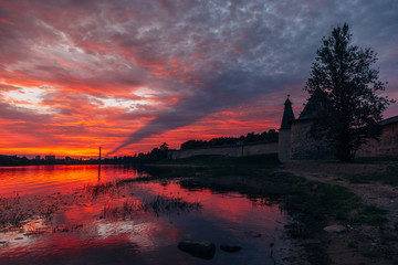 Crimson sunset above Pskov fortress watch towers