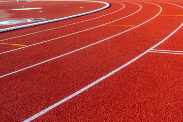 Red running track in stadium