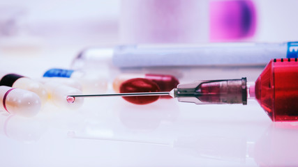 syringe with medicine on white background