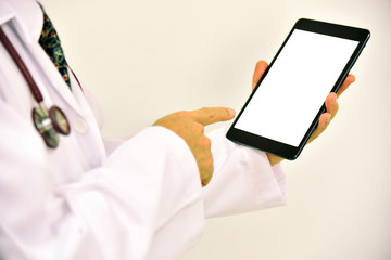 Close-up of doctor hands using smartphone for order antibiotic in hospital network or social networks concept, man typing an sms message to his friends.
